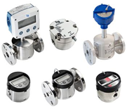 Digital turbine flow meters for industrial fluid measurement with electronic display and stainless-steel housing.
